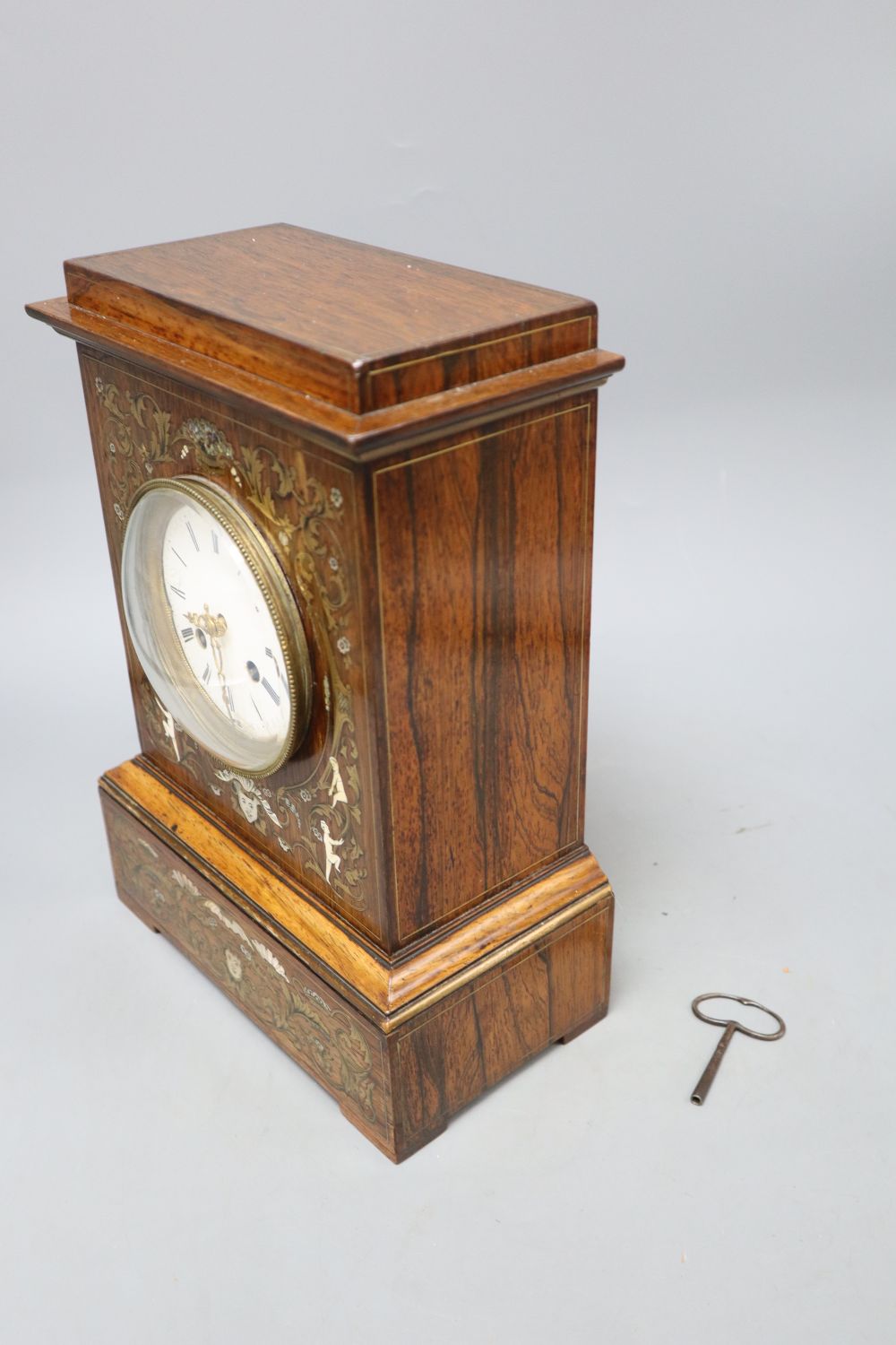 A 19th century French inlaid rosewood cased eight day mantel clock, with brass, mother of pearl and bone inlay, height 31cm